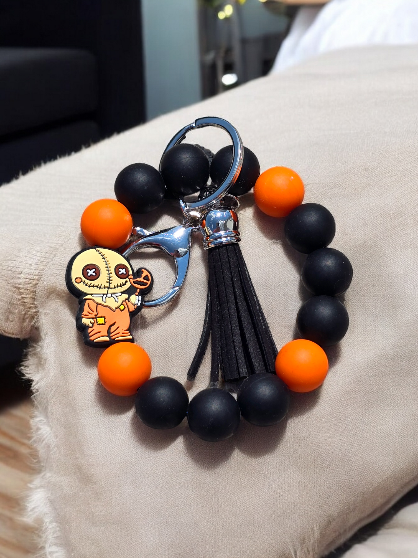 Orange and black wristlet
